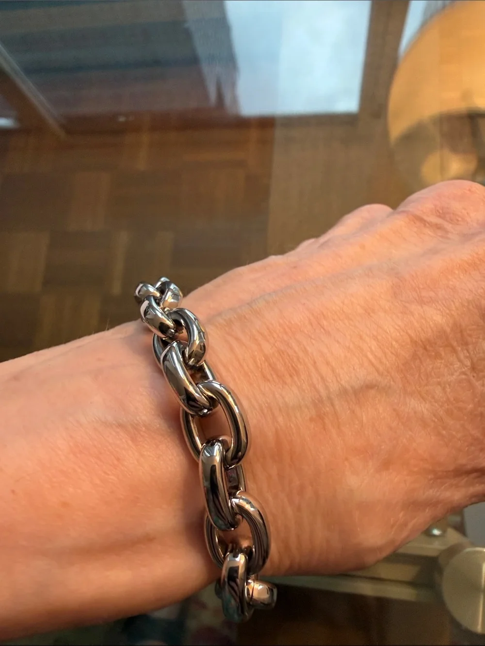 Michael Kors Silver-tone Toggle Bracelet with Dual Sided Logo Charm.